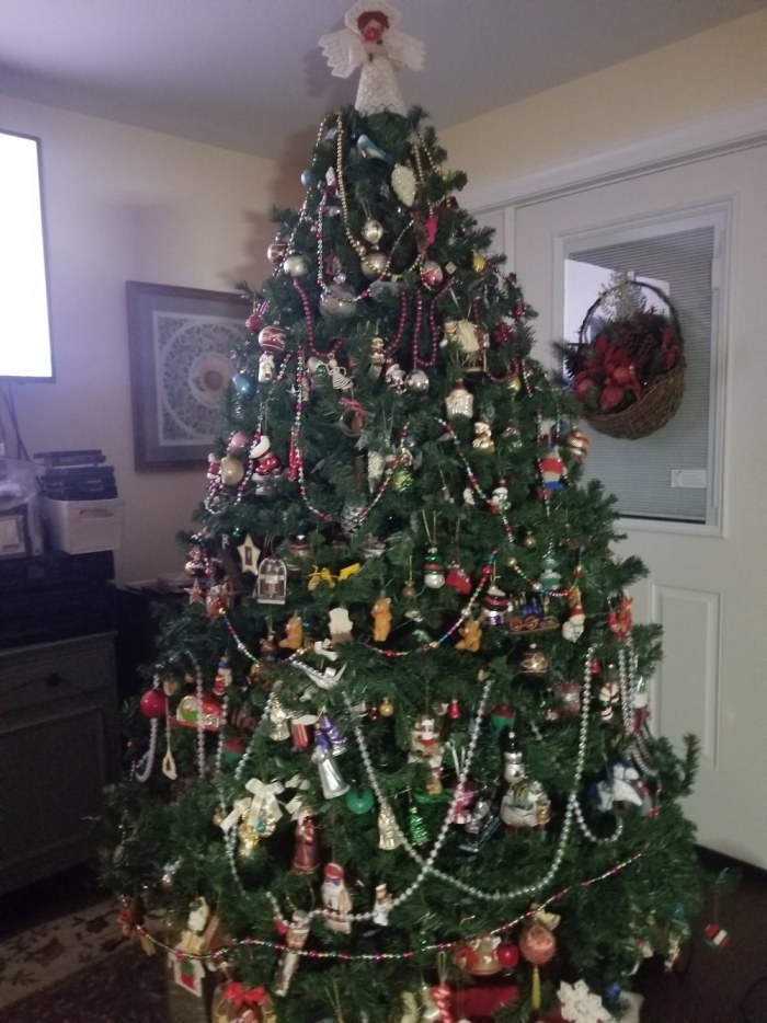 Unlit Christmas tree + needlepoint Angel topper.jpg
