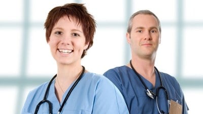 Certified nursing assistants in scrubs with stethoscopes, representing CNA training and healthcare careers in Miami.