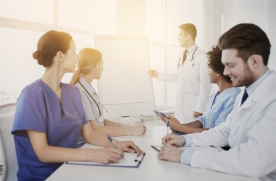 Nurse educator teaching a group of nursing students in Ohio during a classroom-based training session.