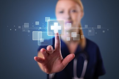 Nurse informatics student in Texas interacting with a digital health interface representing electronic medical records.